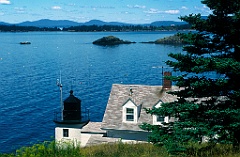Browns Head Light Over Bay in Maine